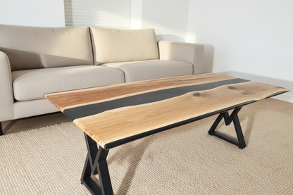 STRØM river coffee table with dark epoxy resin and live edge oak on black steel legs in modern living room